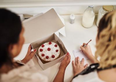 Women discussing starting a cake business